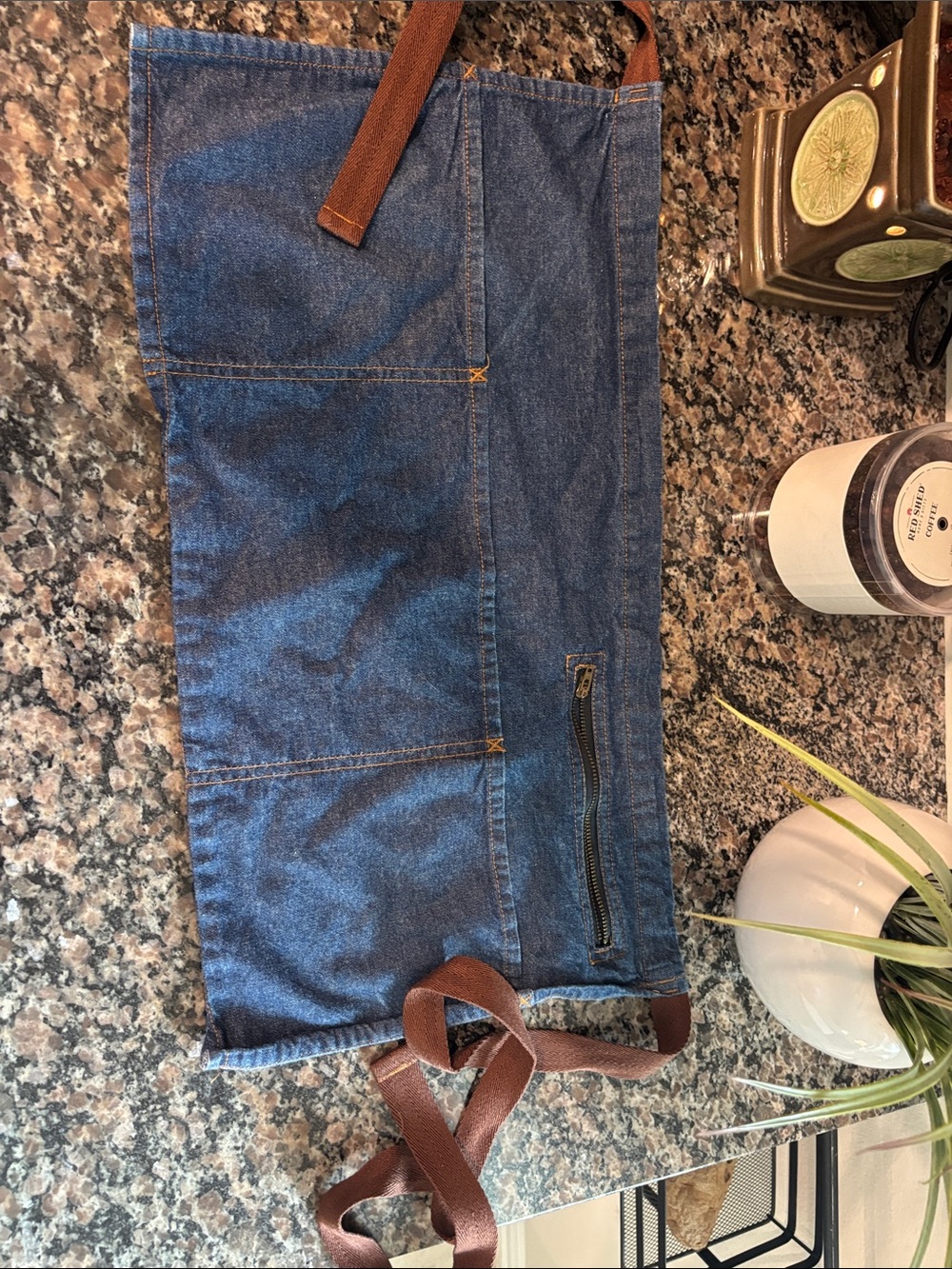 Denim Waist Apron with Brown Straps for a waitress zipper pocket for tips.